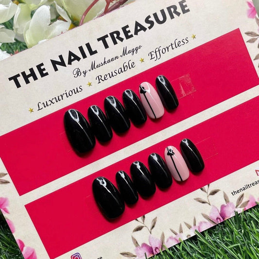 Cutesy- Black glossy press on nails with detailing of handpainted art on fake nails.