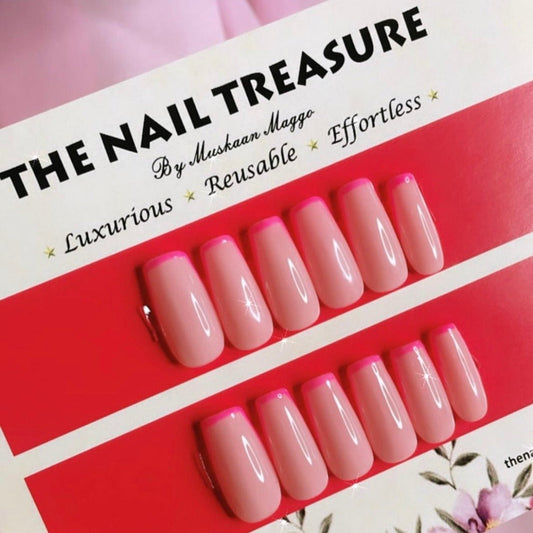 Preetines press on nail set on nude base with pink french art.