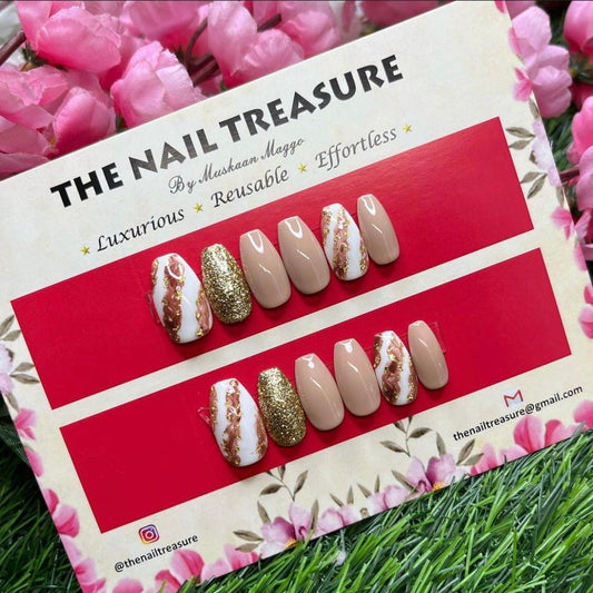 Glittery nudes best sellers of the nail treasure collection, designed with handpainted art & glitter. Best fake nail design