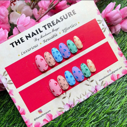 Little hearts is a colourful matte Press on nail set. These Fake nails designed in with handpainted heart in matte finish.